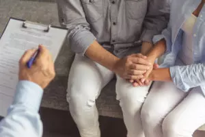 Couple with Doctor for Anxiety Treatment